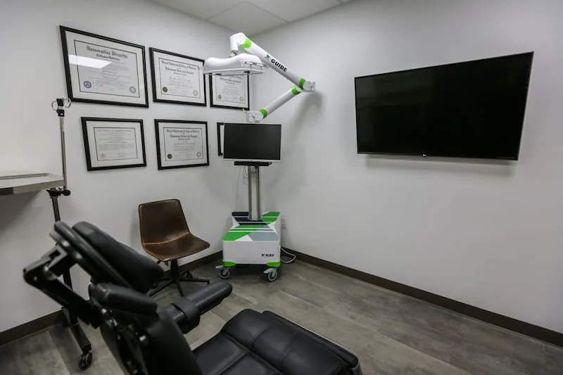 Patient room with Dental chair, TV and imaging machine